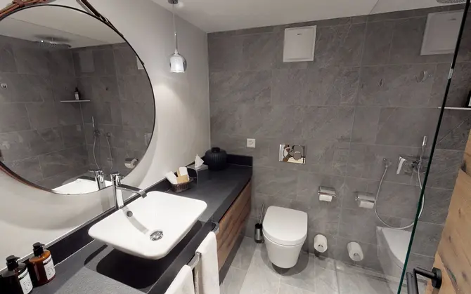 Shower room in a Classic single room at Walliserhof Gand-Hotel & Spa, Saas Fee