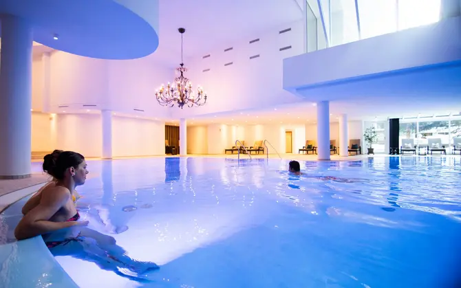 Lady sitting in the hotel pool 