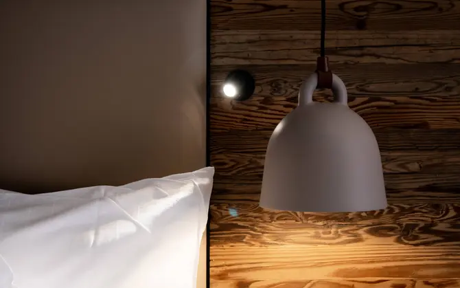 Bedside lamp in a Classic single rooms at Walliserhof Gand-Hotel & Spa, Saas Fee