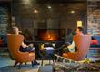Two people in front of the fireplace